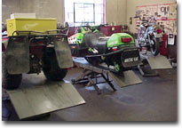 Shop at Honda Town showing repair of motorcycles, snowmobiles, atvs and more